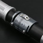 Cere lightsaber hilt detail on dark background