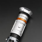 Cere lightsaber hilt detail on dark background