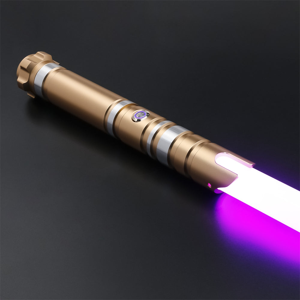 Regalia - Gold lightsaber with ignited purple blade on dark studio background